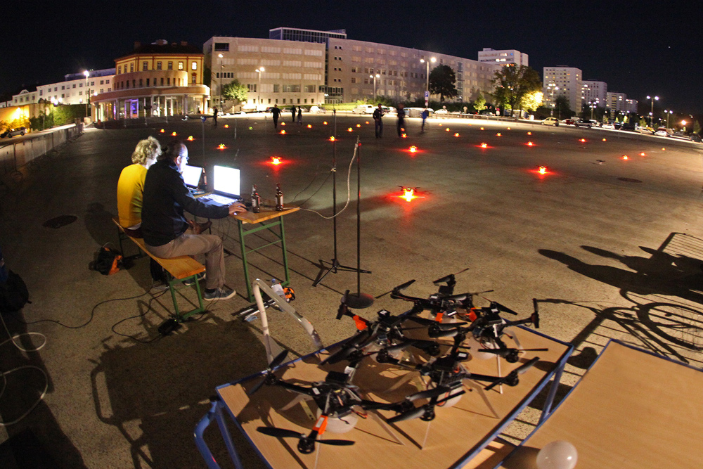Futurelab technicians prepare drones for an aerial swarming performance.