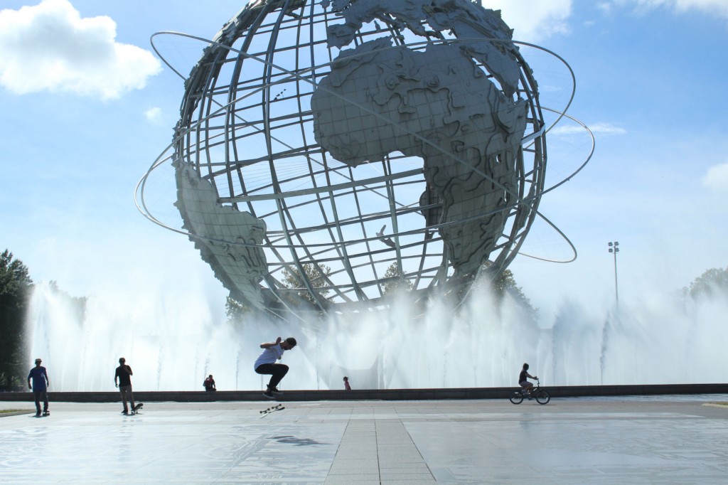 Skateboarders in front of the Unisphere in Flushing Meadows Park, on of the attractions of the 1964. World's Fair. 