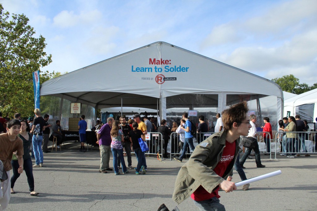 Long lines formed at tents where participants learned how to solder circuit boards.