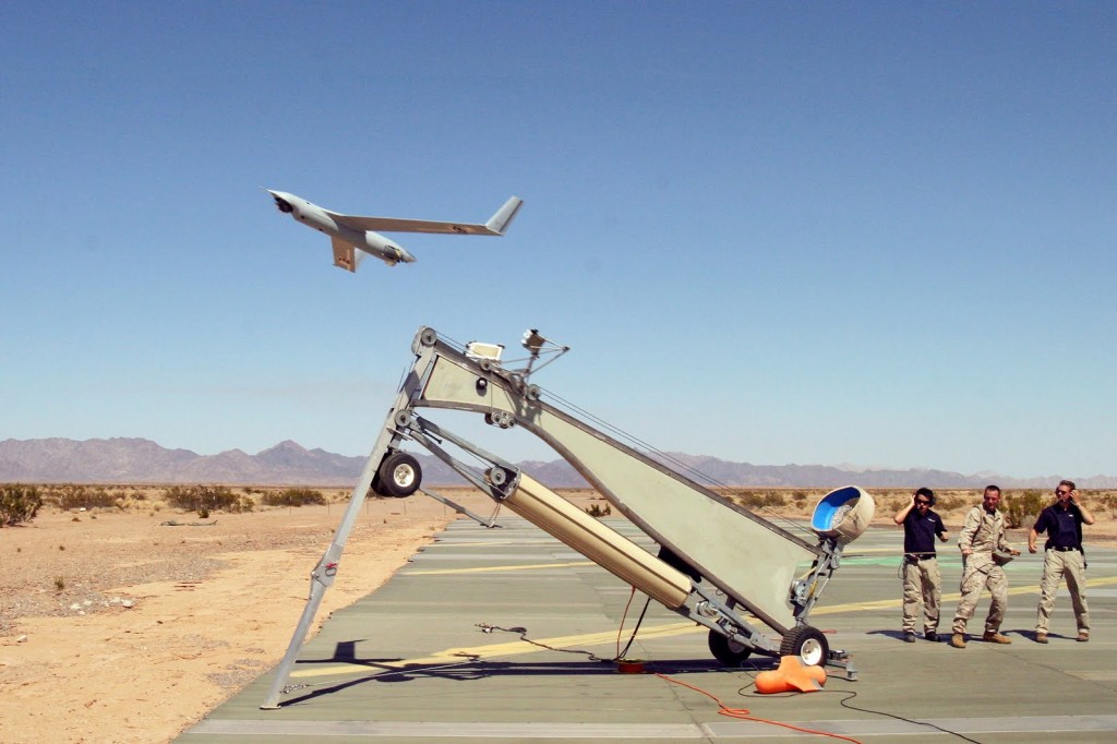 Yuma, Ariz. (June 16, 2006) - U.S. Marine Corps Sgt. Michael Kropiewnicki, a Combat Videographer assigned to 2nd Marine Aircraft Wing (MAW) Combat Camera, launches a Boeing Scan Eagle Unmanned Aerial Vehicle (UAV) during the training exercise Desert Talon 2-06 onboard Marine Corps Air Station (MCAS). Credit: U.S. Marine Corps photo by Sgt Guadalupe M. Deanda III 