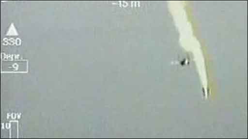 A still showing a fighter jet launching a missile at a Georgian drone. 