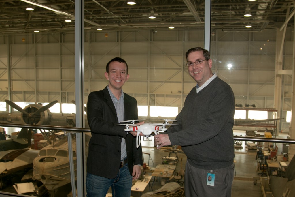 Dan Gettinger hands over the DJI Phantom drone to Roger Connor, curator of the NASM UAV exhibit. 