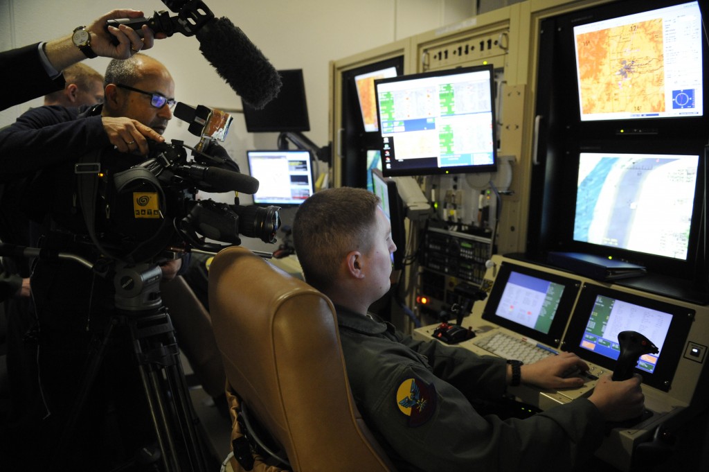 Media outlets interview a British MQ-9 Reaper sensor operator during a training mission at Holloman AFB in 2012. Credit: U.S. Air Force photo by Staff Sgt. Carolyn Herrick/Released