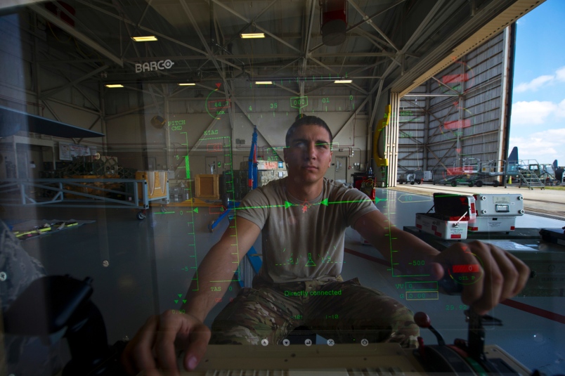 An Air Force airman at the control module of an MQ-9 Reaper. Credit: John Bainter/USAF