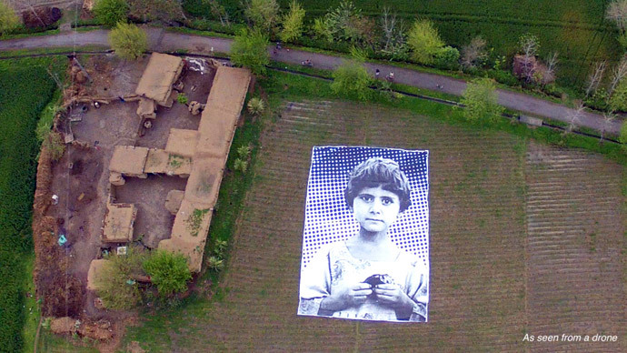 A giant portrait of an young, unnamed victim of a drone strike was unveiled in Pakistan this week. Credit: from notabugsplat.com