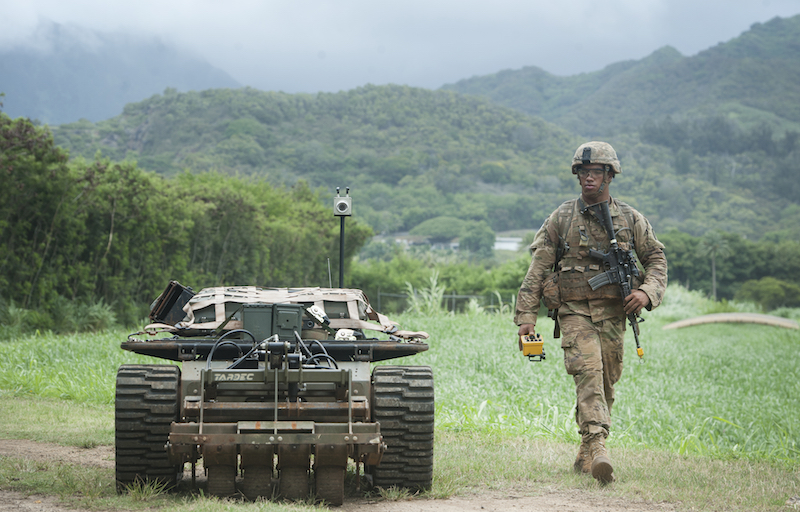 An PACMAN-I unmanned ground vehicle accompanies a U.S. Army solider during the Pacific Manned Unmanned – Initiative on July 22, 2016 inHawaii. Credit: Staff Sgt. Christopher Hubenthal/U.S. Air Force